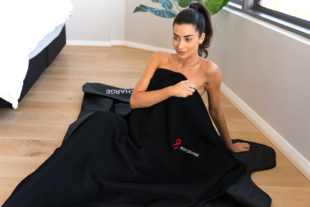 Woman Using Infrared Sauna Blanket Insert